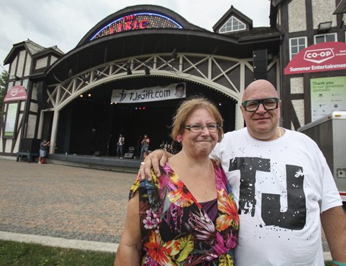 A bit of rain falling on Assiniboine Park didn't deter concert-goers from attending a free rock concert at the Lyric Theatre. Organized by Karen (left) and Floyd Wiebe, parents of the late TJ Wiebe who got mixed up in drug culture at a young age. The concert had an anti-drug theme. Saturday, August 31, 2013. (BILL REDEKOP) (JESSICA BURTNICK/WINNIPEG FREE PRESS)