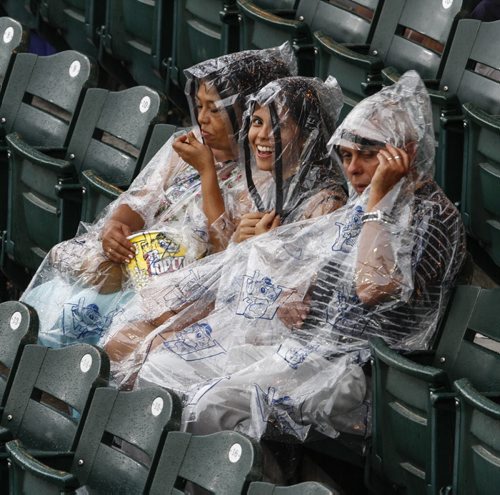 Fans patiently wait in the stands for a rainy front to pass over Shaw Park on Saturday night. The Winnipeg Goldeyes will face off tonight (weather-permitting) against the Fargo-Moorhead Redhawks. Saturday, August 31, 2013. (JESSICA BURTNICK/WINNIPEG FREE PRESS)