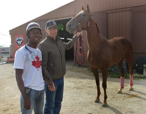 At the stables at the Assiniboine Downs, jockey Tyrone Nelson (left) and trainer Tom Gardipy Jr. with Thunderclap Newman who has won the last two marathon events in the four-race series.  Al Besson story Wayne Glowacki / Winnipeg Free Press Sept. 4 2013