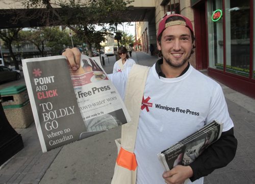 Brad Morrison handing out free Winnipeg Free Press newspapers on Portage Ave. and Carlton St¤on the morning of the launch of the new Blippar App. (Note he is not a free press employee, just hired for the day) Wayne Glowacki / Winnipeg Free Press Sept. 4 2013