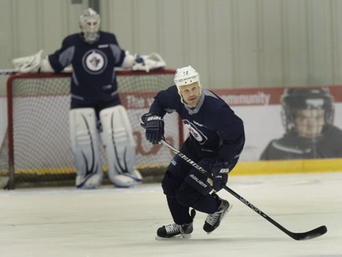 Some Winnipeg Jets players and rookies take part in an informal practice at the MTS Iceplex Wednesday morning. Jets forward #12 Olli Jokinen at right. Gary Lawless Story. Wayne Glowacki / Winnipeg Free Press Sept. 4 2013