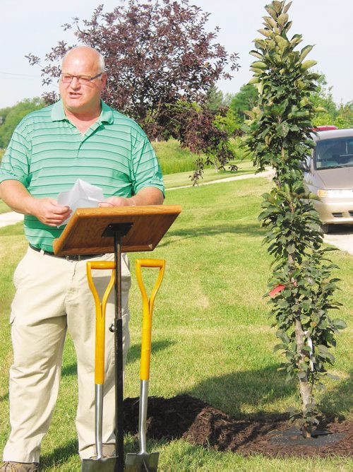 Canstar Community News Aug. 27, 2013 - RM of Cartier reeve Roland Rasmussen speaks on behalf of the municipality at a tree planting ceremony in Elie on Aug. 27. (ANDREA GEARY/CANSTAR COMMUNITY NEWS)