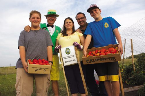 Canstar Community News Aug. 27, 2013 - From left to right, Evan Evaniuk, Hi Neighbour Sam (Peter Martin), Lt. Shari Howells, Lt. Mike Gnutel, and Riley Howells are shown with the tomatoes the RCSCC #350 Transcona Sea Cadets grew for Winnipeg Harvest. (DAN FALLOON/CANSTAR COMMUNITY NEWS/HERALD)
