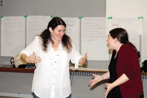 Canstar Community News Hope McIntyre (left) and co-facilitator Kerri Potter share a laugh during a drama session for an upcoming production called Giving Voice.