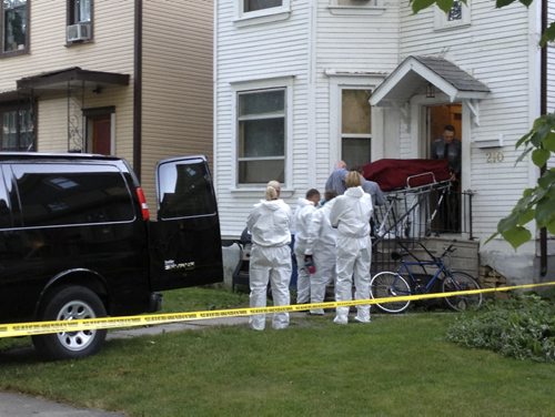 A body is removed from a crime scene at 210 Chestnut St. near Preston Ave. Wednesday morning September 4 2013. Kevin Rollason story. Adam Wazny / Winnipeg Free Press