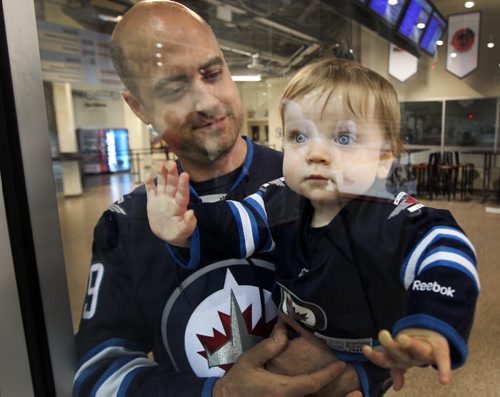 Starting Young- Josh Whiteside- 9 1/2 months with his father Wesley  at Winnipeg Jets Rookie Camp at the MTS Iceplex Thursday-See Ed Tait Story- Sept 03, 2013   (JOE BRYKSA / WINNIPEG FREE PRESS)