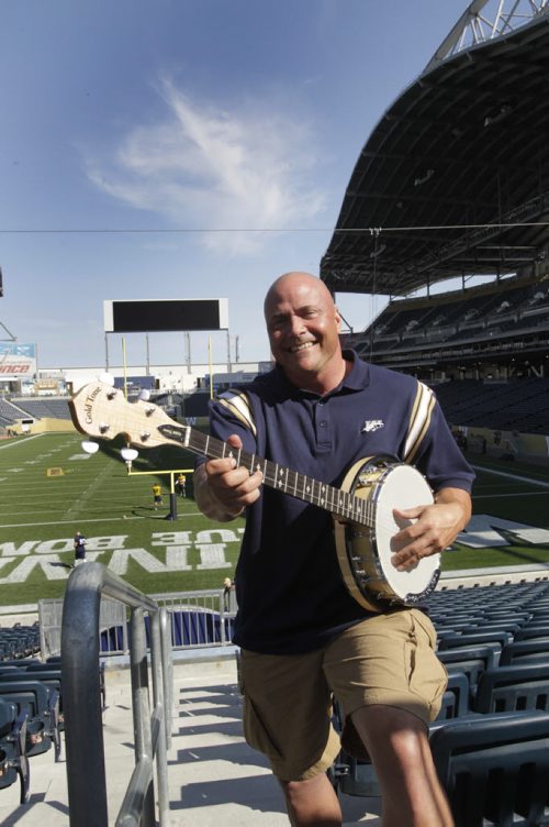 Sports/front page game day wrap.Troy Westwood poses with a Banjo in Investors Group Field for the up coming Banjo Bowl. Wayne Glowacki / Winnipeg Free Press Sept.5 2013