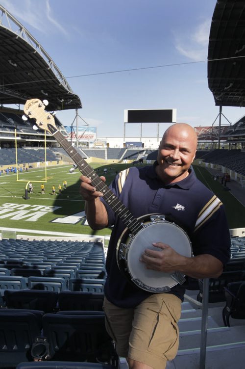 Sports/front page game day wrap.Troy Westwood poses with a Banjo in Investors Group Field for the up coming Banjo Bowl. Wayne Glowacki / Winnipeg Free Press Sept.5 2013