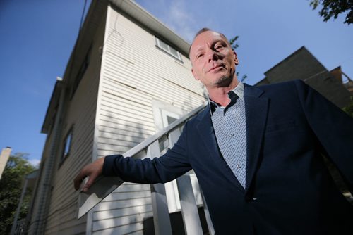 Blair Holm, of Sutten Group Kilkenny Real Estate in front of an old triplex at 290 River Avenue that will be demolished to make way for a condo, Thursday, September 5, 2013. (TREVOR HAGAN/WINNIPEG FREE PRESS) - see murray mcneill