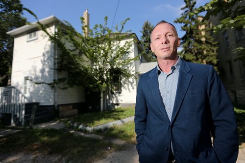 Blair Holm, of Sutten Group Kilkenny Real Estate in front of an old triplex at 290 River Avenue that will be demolished to make way for a condo, Thursday, September 5, 2013. (TREVOR HAGAN/WINNIPEG FREE PRESS) - see murray mcneill