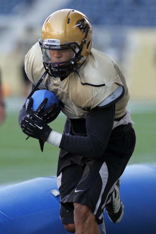 Feature on running back Anthony Coombs of the University of Manitoba Bisons. BORIS MINKEVICH / WINNIPEG FREE PRESS. August 5, 2013