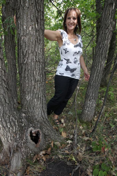 Stephanie Staples by her secret tree along the Seine River that she writes aboutSee Our Winnipeg story- Sept 06, 2013   (JOE BRYKSA / WINNIPEG FREE PRESS)