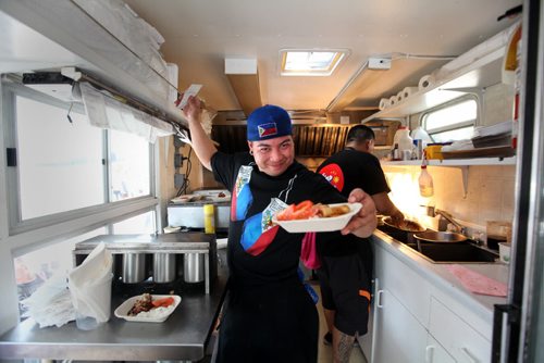 Roddy Seradilla dishes out filipino cuisine in his Pimp my RIce truck during Manyfest Food Truck Wars  on Broadway over the weekend.  See Adam Wazny's story. Sept 07,, 2013 Ruth Bonneville Winnipeg Free Press