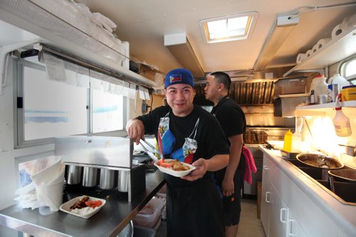 Roddy Seradilla dishes out filipino cuisine in his Pimp my RIce truck during Manyfest Food Truck Wars  on Broadway over the weekend.  See Adam Wazny's story. Sept 07,, 2013 Ruth Bonneville Winnipeg Free Press