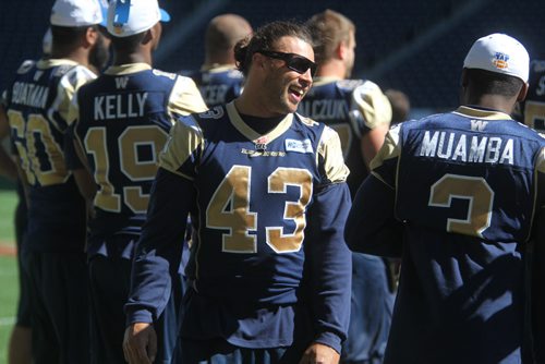 Winnipeg Blue Bombers share some laughs after a walk through practice at Investors Group Stadium Saturday afternoon. Sept 07,, 2013 Ruth Bonneville Winnipeg Free Press