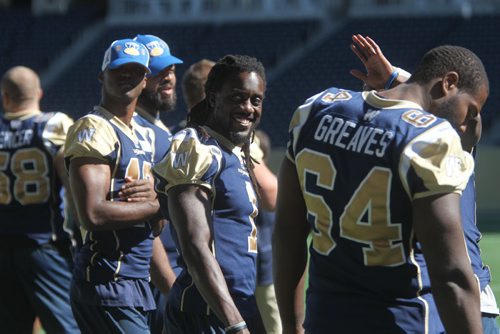 Winnipeg Blue Bombers share some laughs after a walk through practice at Investors Group Stadium Saturday afternoon. Sept 07,, 2013 Ruth Bonneville Winnipeg Free Press