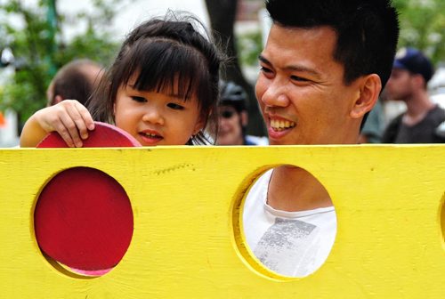 Thu Tran and his daughter, 2, play a game of Giant Connect Four during Cyclovia on Broadway Sunday afternoon.  130908 - September 08, 2013 Mike Deal / Winnipeg Free Press
