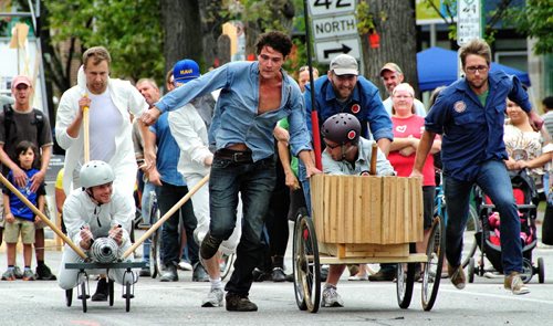 The Riel Gentlemen's Choir takes an early lead in a soapbox race against Team Zephyr during Cyclovia on Broadway Sunday afternoon.  130908 - September 08, 2013 Mike Deal / Winnipeg Free Press