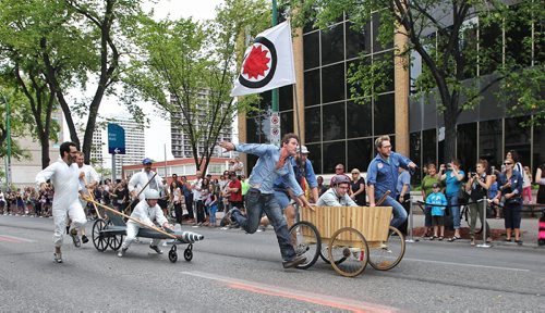 The Reil Gentlemans Choir takes an early lead in a soapbox race against Team Zephyr during Cyclovia on Broadway Sunday afternoon.  130908 - September 08, 2013 Mike Deal / Winnipeg Free Press