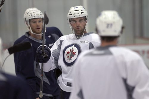 Winnipeg Jets capitan Andrew Ladd, centre,  at practice at the MTS Iceplex Tuesday -See Ed Tait story- Sept 03, 2013   (JOE BRYKSA / WINNIPEG FREE PRESS)