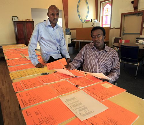 Local sponsors, at right Marcus Askar and Juhar Hargaaya with dozens of files of African refugees with sponsors in Canada whove fled to safety in Djibouti are being flat-out rejected by visa officers. Carol Sanders story.Wayne Glowacki / Winnipeg Free Press Sept. 11 2013