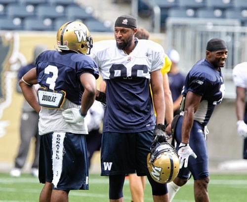 Winnipeg Blue Bombers' Akeem Foster (86) and Cauchy Muamba (3) talk during practice on Wednesday at Investors Group Field. 130911 - September 11, 2013 Mike Deal / Winnipeg Free Press