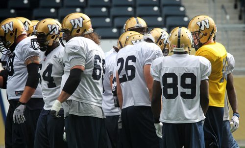 Winnipeg Blue Bomber QB Justin Goltz (18) in the huddle during practice at Investors Group Field Wednesday. 130911 - September 11, 2013 Mike Deal / Winnipeg Free Press