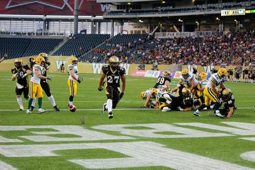 Canstar Community News Manitoba Bisons running back Kienan LaFrance races untouched into the end zone to score the very first Bisons touchdown at Investors Group Field. JORDAN THOMPSON/ CANSTAR COMMUNITY NEWS