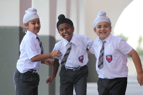 Young Sikh  students have some fun as they goof around outside their school  at Punjab Cultural Centre.  Names Sehaj Singh (Black Turban), Bharjaheen Singh  (chubby) and Baljot Singh (wearing no school crest). Story by Carol Sanders Sept  12,, 2013 Ruth Bonneville Winnipeg Free Press