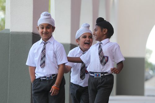 Young Sikh  students have some fun as they goof around outside their school  at Punjab Cultural Centre.  Names Sehaj Singh (Black Turban), Bharjaheen Singh  (chubby) and Baljot Singh (wearing no school crest). Story by Carol Sanders Sept  12,, 2013 Ruth Bonneville Winnipeg Free Press