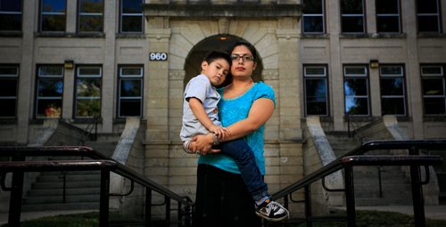 Belhen Rojo and her four-year-old son Jacob in front of Laura Secord School in Wolseley. On the first day of kindergarten, Jacob ended up at the wrong school for the entire day on Monday, without Rojo knowing he had been missing from Laura Secord School until the following day. 130912 - Thursday, September 12, 2013 - (Melissa Tait / Winnipeg Free Press)