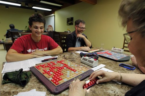 Winnipeg Scrabble Club meets every Thurs at the Kenaston Village Rec Centre. 2013 marks the 75th anniversary of the invention of Scrabble. forground right -Julie Kading. back l-r is Calvin Dick and Colin Viebrock.  BORIS MINKEVICH / WINNIPEG FREE PRESS. Sept. 12, 2013