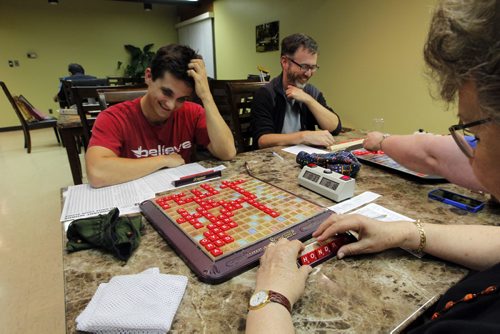 Winnipeg Scrabble Club meets every Thurs at the Kenaston Village Rec Centre. 2013 marks the 75th anniversary of the invention of Scrabble. forground right -Julie Kading. back l-r is Calvin Dick and Colin Viebrock.  BORIS MINKEVICH / WINNIPEG FREE PRESS. Sept. 12, 2013