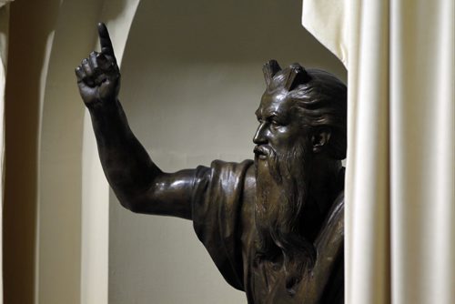 A statue inside the Legislature house overlooks all the MLA's on the final question period Friday morning. BORIS MINKEVICH / WINNIPEG FREE PRESS. Friday Sept. 13, 2013