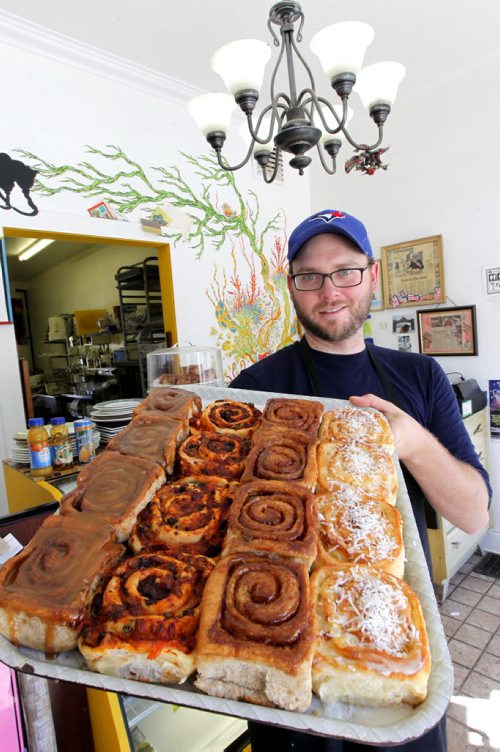 This is for a story celebrating Nat'l Cinnamon Bun Day. Jon McPhail is the owner of Jonnies Sticky Buns at 941 Paortage Ave. BORIS MINKEVICH / WINNIPEG FREE PRESS. Sept. 13, 2013