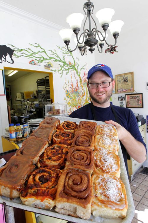 This is for a story celebrating Nat'l Cinnamon Bun Day. Jon McPhail is the owner of Jonnies Sticky Buns at 941 Paortage Ave. BORIS MINKEVICH / WINNIPEG FREE PRESS. Sept. 13, 2013