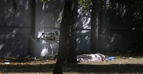 Homeless, one of Winnipeg's North End homeless sleeps in a Park known as "Sniffer Park" at Higgins and Main Friday. See Margo Goodhand Editorial. Sept 13, 2013 - (Phil Hossack / Winnipeg Free Press)