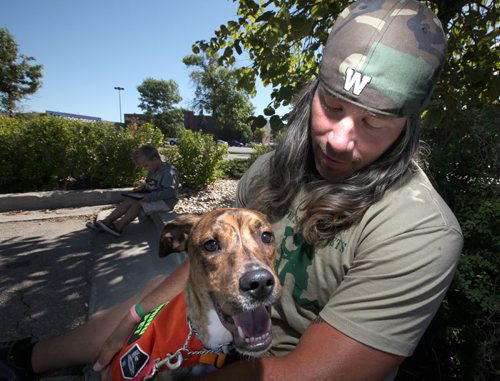 Chris Cvetkovic and his dog Lobo who is going to be donated to be a service dog for veterans. Cvetkovic's son Hudson plays in the background. Doug Spiers story. September 13, 2013 - (Phil Hossack / Winnipeg Free Press)