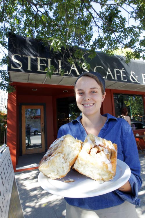 This is for a story celebrating National Cinnamon Bun Day. Rachel Braul from Stells's poses with some buns. BORIS MINKEVICH / WINNIPEG FREE PRESS. Sept. 13, 2013