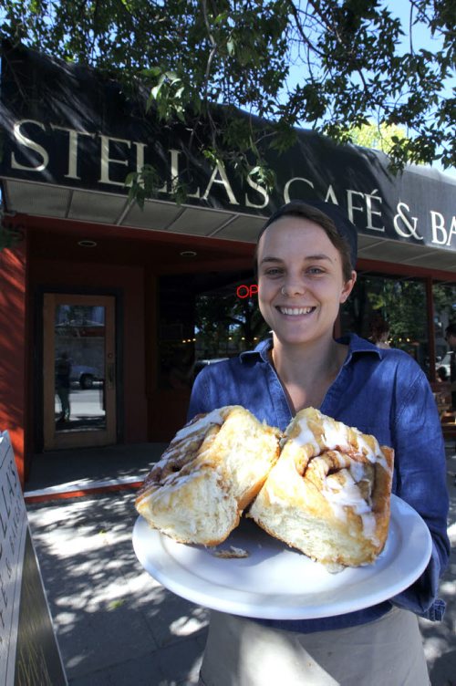 This is for a story celebrating National Cinnamon Bun Day. Rachel Braul from Stells's poses with some buns. BORIS MINKEVICH / WINNIPEG FREE PRESS. Sept. 13, 2013