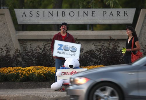 Assiniboine Park Zoo contest entry. 'Assinine Zoo' 2013. Churchill, Manitoba artist, Mark Reynolds staged a protest on Corydon at the entarace to Assiniboine Park Friday night with helper Janice Pennigton- His creation protests the zoo using Churchill's name to promote the zoo's polar bear exhibit.Standup Photo- Sept 13, 2013   (JOE BRYKSA / WINNIPEG FREE PRESS)