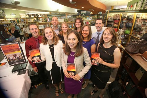 Members of the group of Nine, ex-Hutterites pose for a quick photo in-between signing copies of their book  Hutterites Tell-All at McNally Robinson Saturday afternoon.   Names from left -  Jason Waldner (red) Rodney Waldner (rear left), Karen Waldner (blond), Glenda Maendel (back centre, brown) Junia Waldner (blue), Titus Waldner, Darlene Waldner (black) and Sheryl Waldner (front centre, purple) and Cindy Waldner (cream and black). Sept  14,, 2013 Ruth Bonneville Winnipeg Free Press
