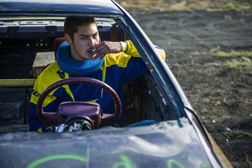 130914 Winnipeg - DAVID LIPNOWSKI / WINNIPEG FREE PRESS (September 14, 2013)  Jamie Friesen has a smoke prior to the start of his race during action from the 4th Annual Teen Challenge Demolition Derby at Red River Co-op Speedway Saturday afternoon.   Daring drivers drove donated vehicles prepared by Teen Challenge students and graduates. Proceeds from the event went towards the addiction recovery and awareness programs offered by Teen Challenge of Central Canada.