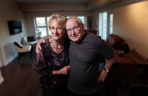 Dave LaBelle poses with his wife Carol. Carol Labelle, owner of Labelles Bridal Shop, is being forced to close down store to look after her husband Dave who has a type of dementia which has changed his personality and caused some memory loss. He is happy happy happy she says. Kevin Rollason story. September 16, 2013 - (Phil Hossack / Winnipeg Free Press)