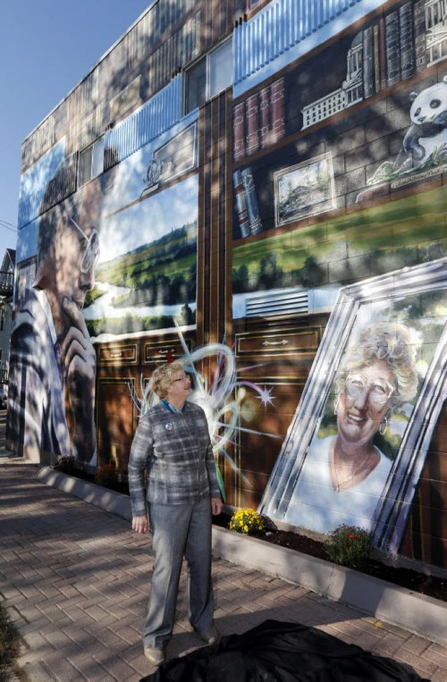 Stdup -Mural of the late William ( Bill ) Norrie , (1979-92) former mayor of Winnipeg , Rhodes Scholar , in pic his wife Helen Norrie ( she also appears in the mural) unveils the  mural by artist Michel Saint Hilaire  & Mandy van Leeuwen , the mural is located  at the corner of Ellice Ave. At Langside St. and is the 70th mural  sponsored by the West End Biz KEN GIGLIOTTI / SEPT 17 2013 / WINNIPEG FREE PRESS