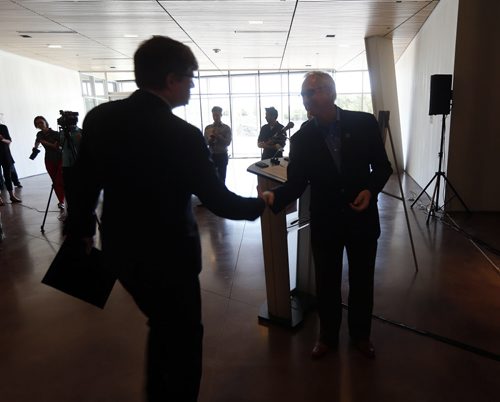 (right) CMHR President and CEO Stuart Murray welcomes  Inn at the Forks  GM Ben Sparrow  to make the announcement inside the restaurant space area - The Canadian Museum for Human Rights announced that Inn at the Forks will operate the Museum's restaurant  , the open plan space will be designed by Number Ten Architectural Group and will feature a ÄúPlanet Earth Äú ceiling feature  and glowing back lite wine bottle display in the main floor entrance of the museum . ( kirbyson story )  KEN GIGLIOTTI / SEPT 17 2013 / WINNIPEG FREE PRESS