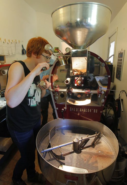 Green Bean Coffee Imports in Petersfield, Manitoba. Owner Derryl Reid. His daughter Alix, in photo,  works there roasting coffee beans. BORIS MINKEVICH / WINNIPEG FREE PRESS. Sept. 17, 2013