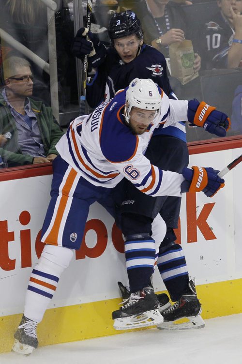 Edmonton Oilers' Jesse Joensuu (6) and Winnipeg Jets' Jacob Trouba (3) collide during first period pre-season NHL action in Winnipeg on Tuesday, September 17, 2013. (John Woods / WINNIPEG FREE PRESS)