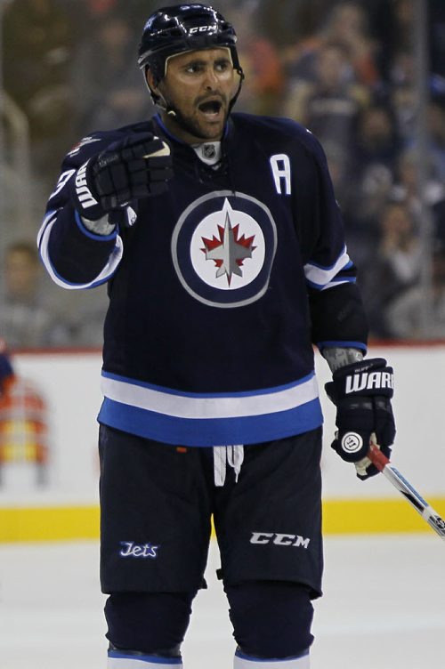 Winnipeg Jets' Dustin Byfuglien (33) yells at a referee during third period pre-season NHL action against Edmonton Oilers in Winnipeg on Tuesday, September 17, 2013. (John Woods / WINNIPEG FREE PRESS)
