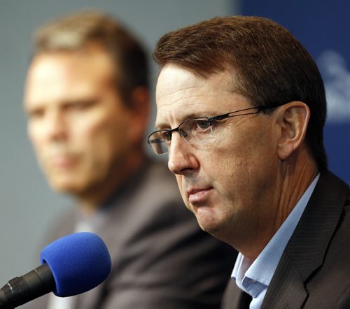 (right) Winnipeg Jets Executive Chairman & Governor Mark Chipman announced that the Wpg jets will extend the contract of  (left)  GM Kevin Cheveldayoff at a  MTS Centre newser   KEN GIGLIOTTI / SEPT 18 2013 / WINNIPEG FREE PRESS